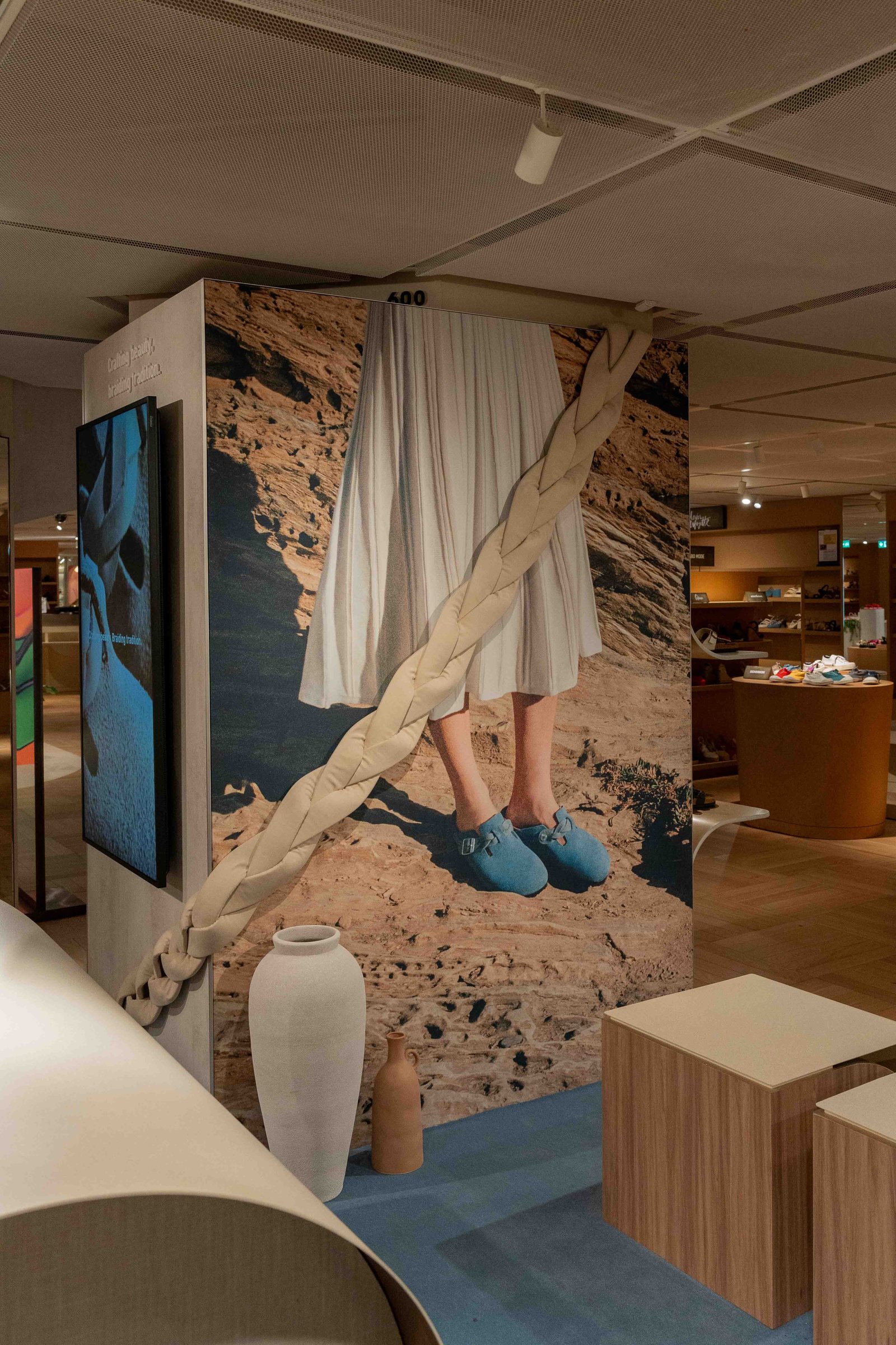 Birkenstock corner at Galeries Lafayette Haussmann, braid campaign visual and wooden furniture